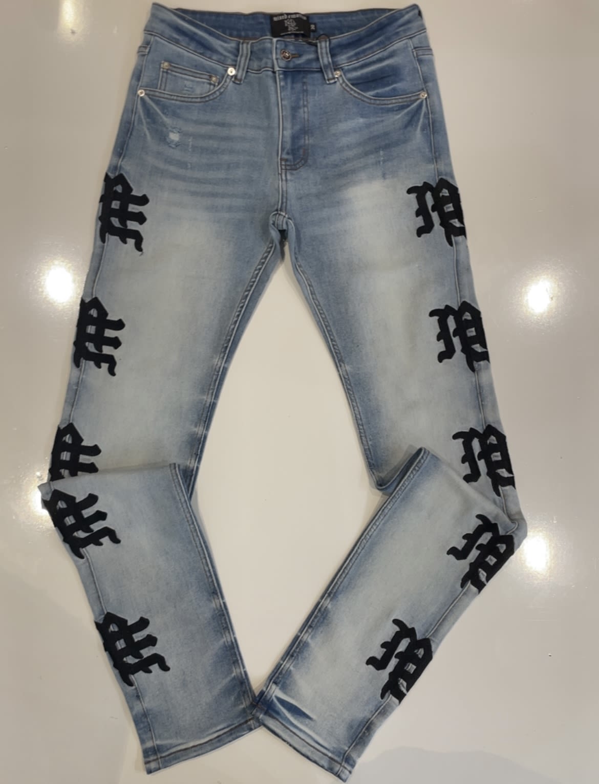 Mixed Emotions Monogram Jeans Light Wash